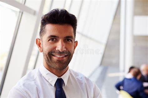 Portrait Of Hispanic Businessman In Modern Office Stock Photo Image