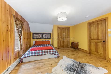 Interior Shot of a Wooden Bedroom with a White Ceiling and a Decorative ...