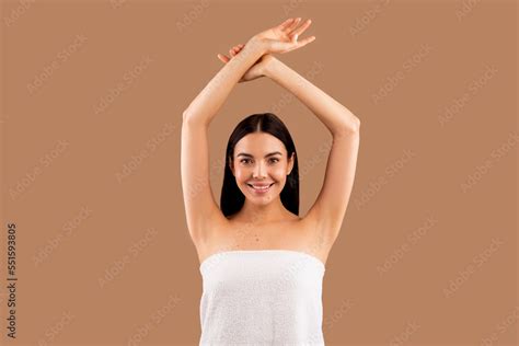 Beautiful Half Naked Woman With Hands Up Posing On Beige Stock Photo