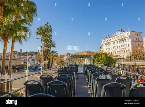 Seats In A Tour Bus With A View Of The Pedestrians Palm Trees And