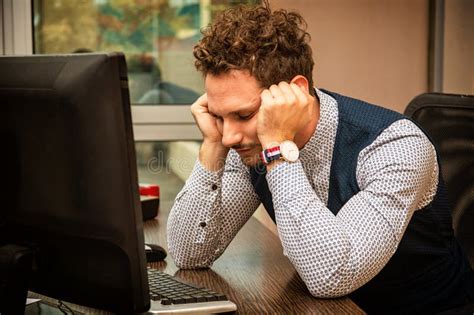 Preoccupied Worried Male Worker Staring At Computer Stock Image