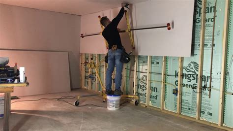 How To Hang 14 Ft Sheet Of Drywall Alone Youtube