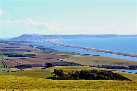 View Of Chesil Beach With Portland In The Distance And St Catherines