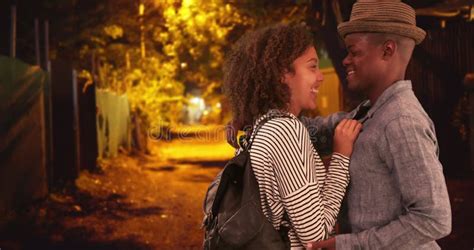 Black Millennial Man And Woman Flirt In A Dark Alley Stock Footage