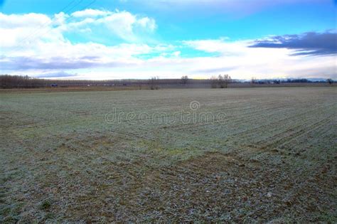 Ploughed Field In The Italian Countryside On A Cloudy Day In Winter