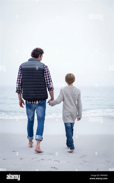 Father And Son Walking Away From Each Other