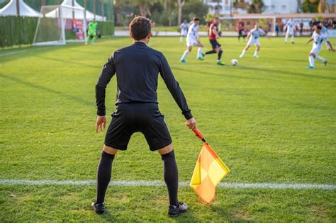 Premium Photo Assistant Referee In A Football Match Watching The Game