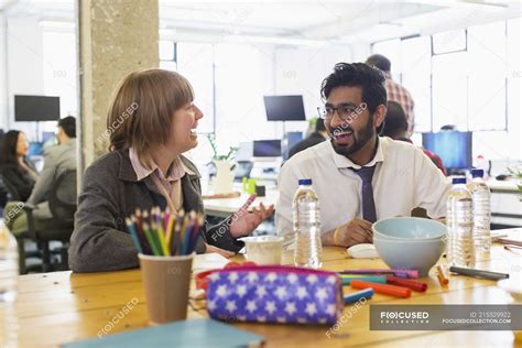 Laughing business people talking in office — indoor, backdrop - Stock ...