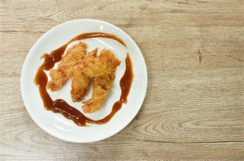 Crispy Fried Chicken Fillet With Bread Crumb And Egg Yolk On Plate