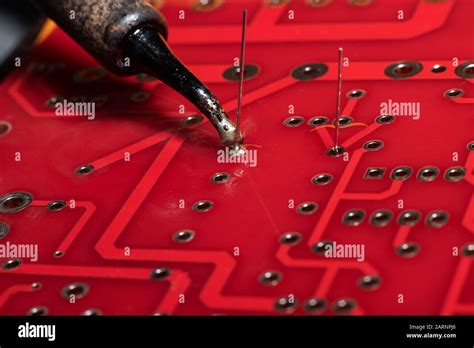 Soldering process on a printed circuit board Stock Photo - Alamy