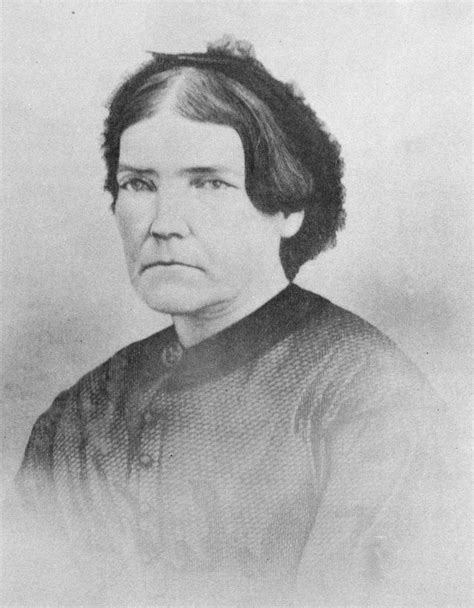 An Old Black And White Photo Of A Woman