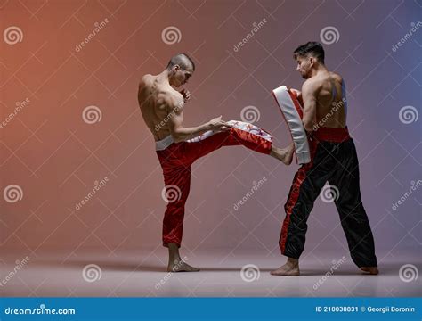 Sparring Of Boxers Two Fighting Males In Boxing Gloves During Battle Martial Arts Mixed Fight