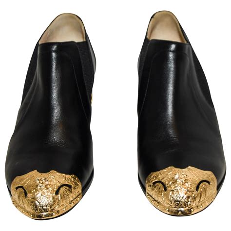 Chanel Black Paris To Dallas Ankle Booties Gold Tone Cap And Sheriffs