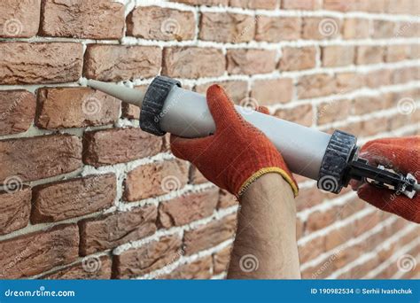 Applying Grout With A Syringe Grouting Decorative Tile With White