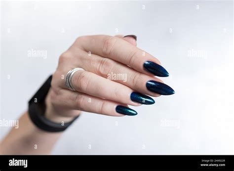 Woman S Beautiful Hand With Long Nails And Turquoise Green And Blue