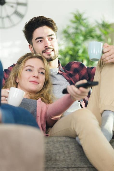 Happy Young Couple Watching Tv on Couch Stock Photo - Image of leisure ...