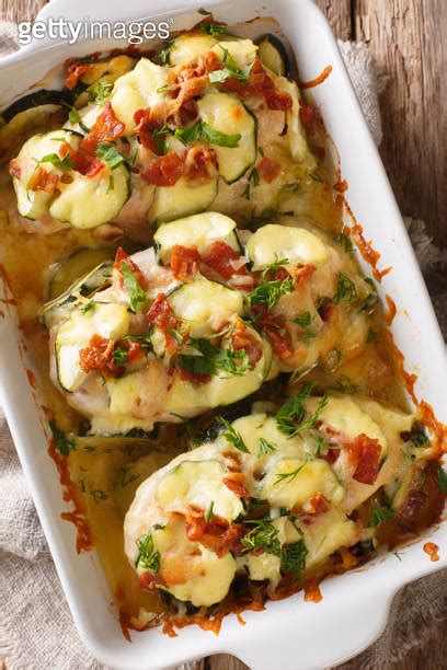 Summer Food Baked Chicken Fillet With Zucchini Bacon And Cheese Close Up In A Baking Dish