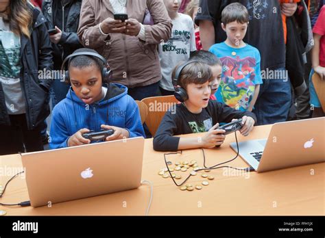 Children Playing Video Games On Apple Powerbook Laptop Computers Usa