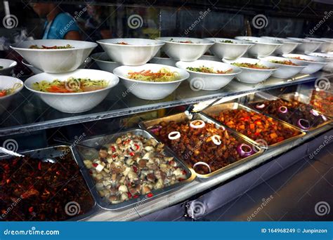 Assorted Cooked Food On Display At A Neighborhood Eatery Stock Image