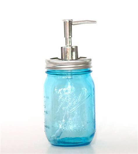 A Mason Jar With A Soap Dispenser On It