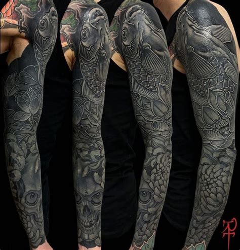 Tattoos On The Arms And Legs Of Men With Dragon Fish And Flower Tattoo