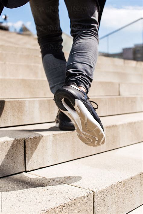 "Feet In Sport Shoes Stepping Up The Stairs" by Stocksy Contributor "Irina Efremova" - Stocksy