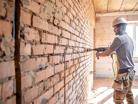 Comment réparer les fissures dans un mur en briques Gros Travaux