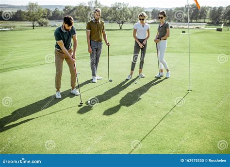 People Playing Golf Outdoors Stock Photo Image Of Putting