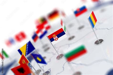 Serbia flag in the focus. Europe map with countries flags Stock Photo ...