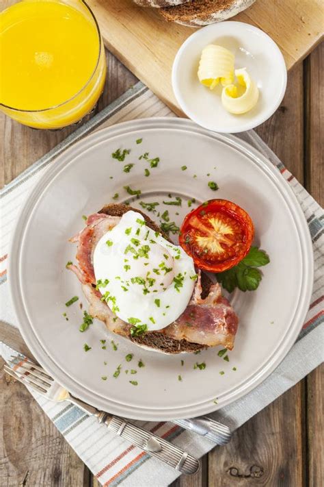 Poached Egg And Bacon On Rye Bread Healthy Breakfast Stock Image