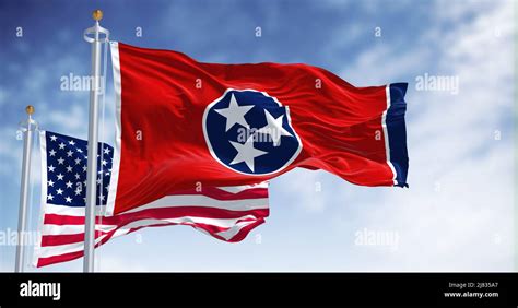 The Tennessee state flag waving along with the national flag of the ...