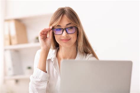 Woman In Eyewear Using Laptop Working In Office Stock Image Image Of Indoor Computer 167067723