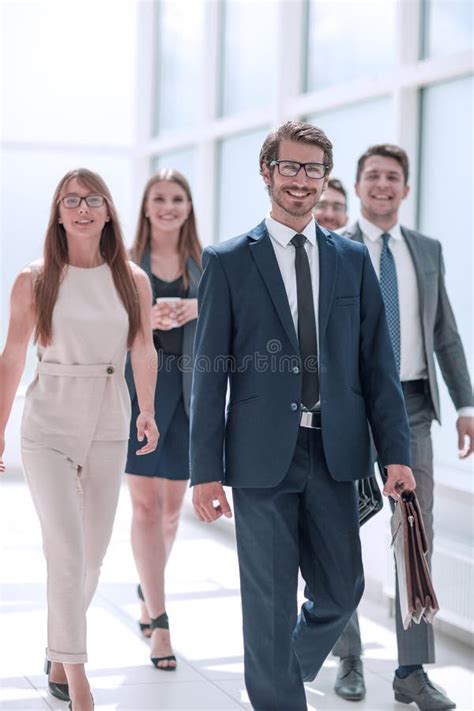 Confident Businessman And His Business Team Passing Through The Office