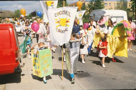 Parade of children and adults in costumes - Living Archive