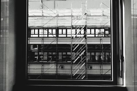 Premium Photo | Reflection of building on glass window