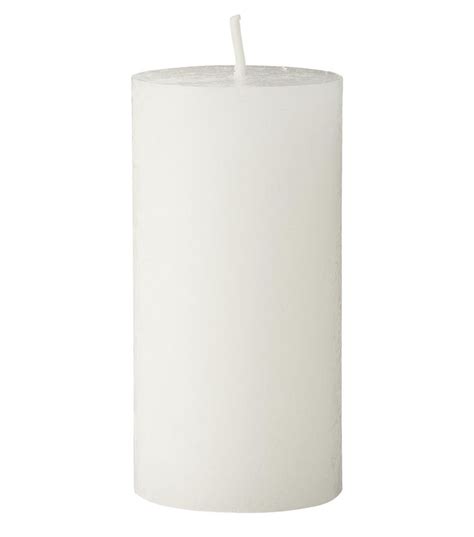 A White Pillar With A Single Candle Sticking Out Of It S Center On A