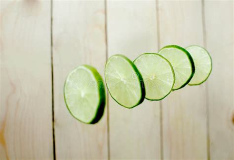 Lime Wedges on Wooden Background Stock Image - Image of black ...