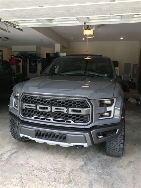 A Grey Truck Parked In A Garage