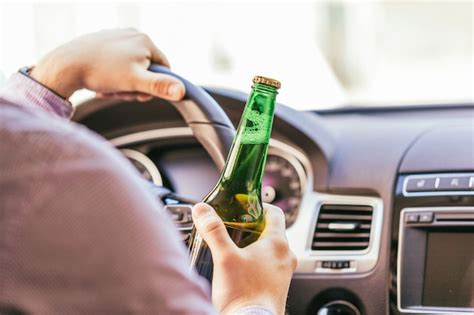 Man Drinking Beer In Car Photo Free Download