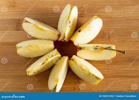 Many Sliced Pieces Of Apple Folded In A Circle Top View Stock Photo