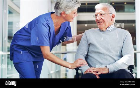 Healthcare Nurse And Retirement Man In A Rehabilitation Nursing Home For Disability Health