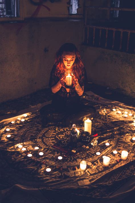 Woman with candles during occult ritual · Free Stock Photo