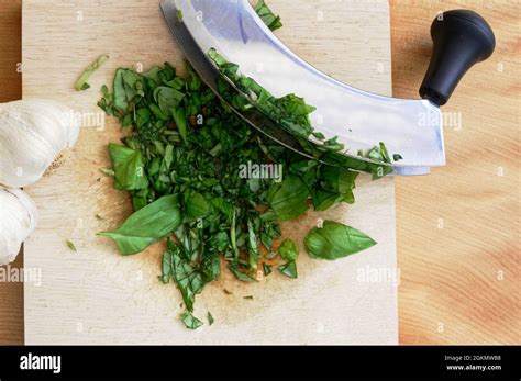 The Sharp Shiny Blades Of A Rocking Knife Which Is Being Used To Cut