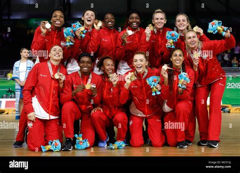 The England Womens Netball Team Celebrate With Their Gold Medals At