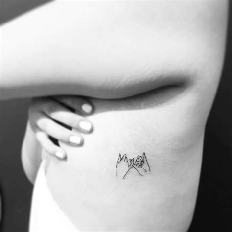 Fine Line Style Pinky Promise Tattoo Located On The