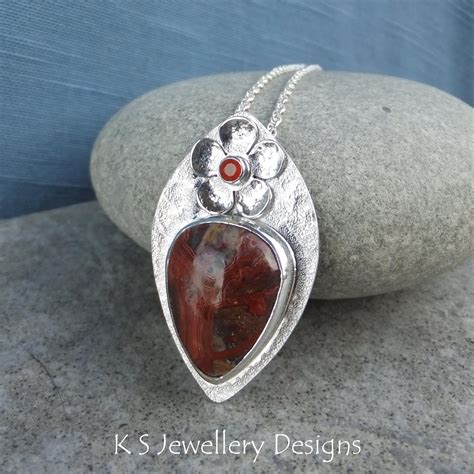 Crazy Lace Agate And Carnelian Flower Adorned Sterling Silver Drop