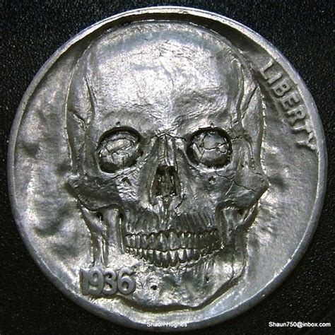 A Silver Coin With A Skull On It