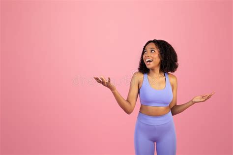 Surprised Glad Millennial African American Lady In Sportswear With Open