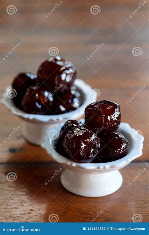 Sweet Jujube Or Chinese Red Date In Syrup In White Thai Style Cup On