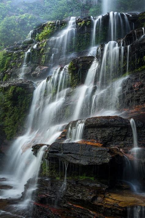 Large Waterfall Cascading Down Rocks In Blue Mountains Australia Stock